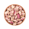 A wooden cup of borlotti beans