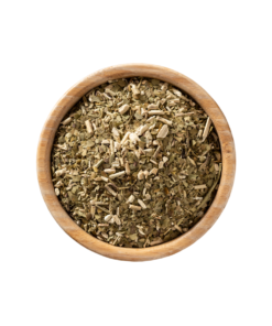 Herbal tea Yerba Mate loose leaves in a wooden bowl.