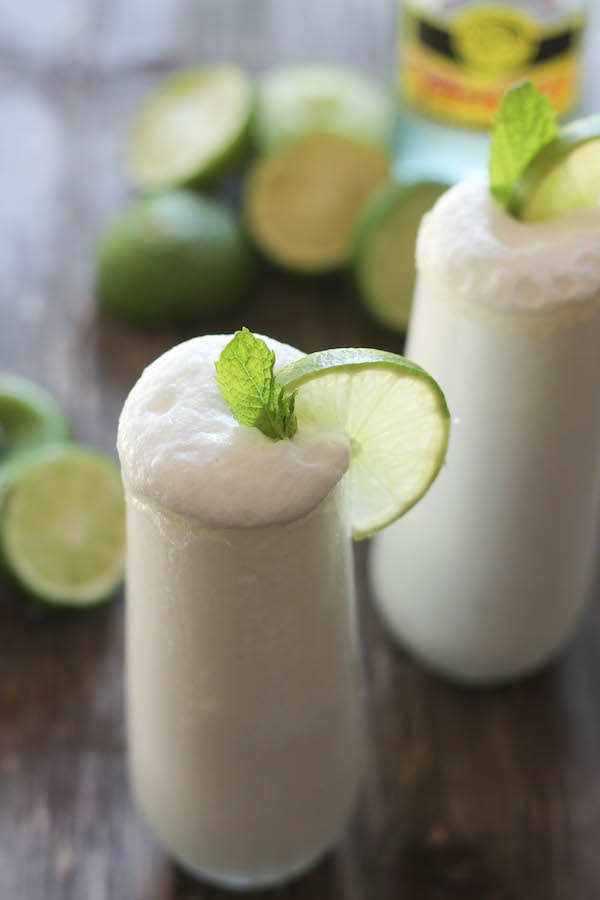 a glass of Coconut Lime Fizz Cooler, a recipe using Bali Buda raw and real honey
