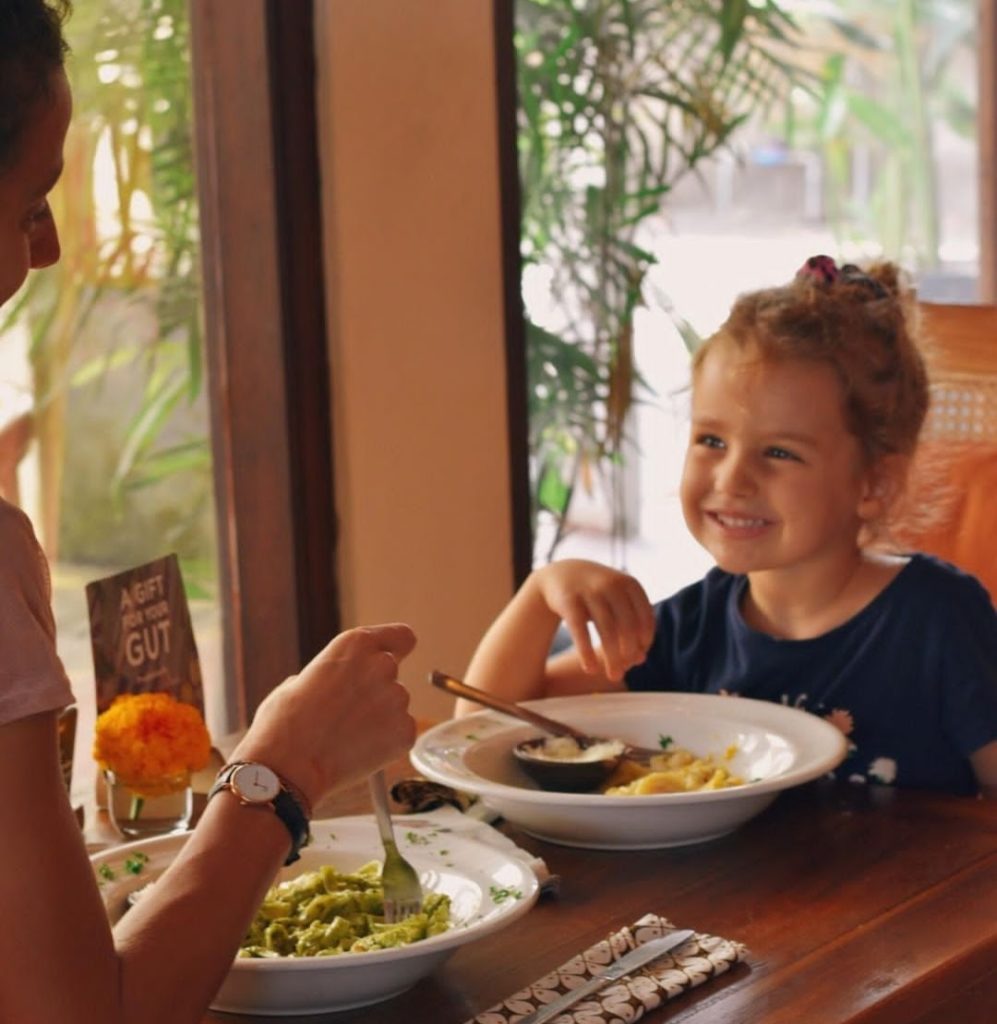 A mum and her daughter, enjoying their meal at Bali Buda Ubud Cafe